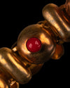 Brazalete Articulado de Latón Dorado con Cabujones Rojos y Negros