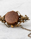 Broche victoriano con piedra goldstone